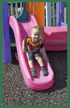 Child playing outside at Stages